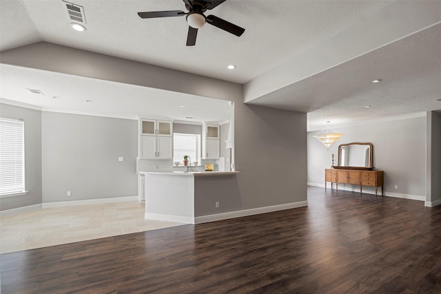 23826 Spring Dane Dr, Spring, TX 77373 - unfurnished living room featuring a ceiling fan, light wood finished floors, a textured ceiling, and recessed lighting