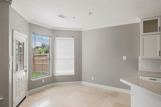 23826 Spring Dane Dr, Spring, TX 77373 - unfurnished dining area with ornamental molding and a textured ceiling