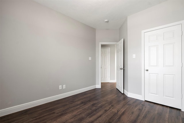23826 Spring Dane Dr, Spring, TX 77373 - unfurnished bedroom featuring dark wood-style flooring and baseboards