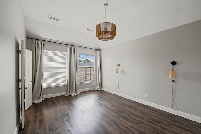 23826 Spring Dane Dr, Spring, TX 77373 - spare room with wood finished floors, vaulted ceiling, and a textured ceiling