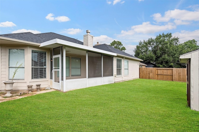 23826 Spring Dane Dr, Spring, TX 77373 - back of property featuring a fenced backyard, roof with shingles, a chimney, and a sunroom