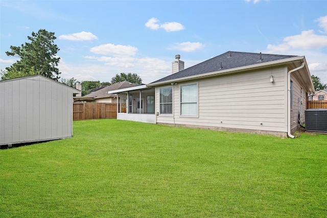 23826 Spring Dane Dr, Spring, TX 77373 - rear view of house featuring a chimney, a sunroom, and a storage unit