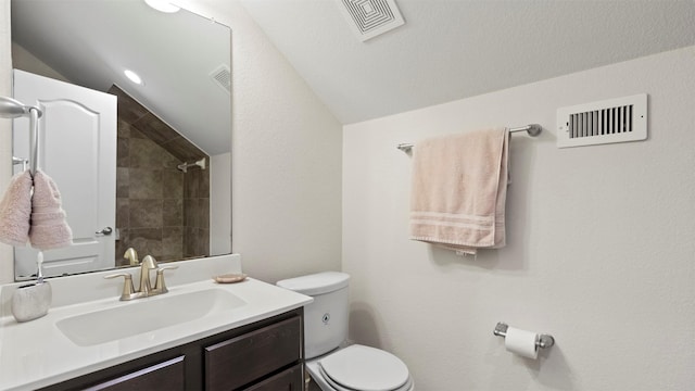 15314 Icet Creek Ave, Mont Belvieu, TX 77523 - bathroom featuring vanity, lofted ceiling, and tiled shower