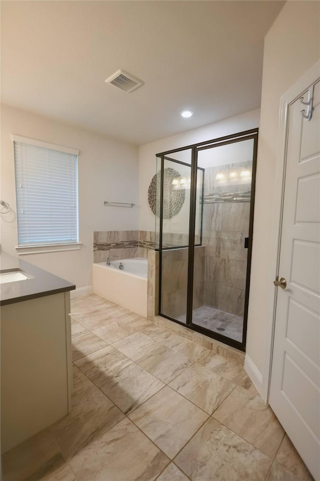 20503 Montecrest Cir, Spring, TX 77379 - bathroom featuring a garden tub, a shower stall, and vanity