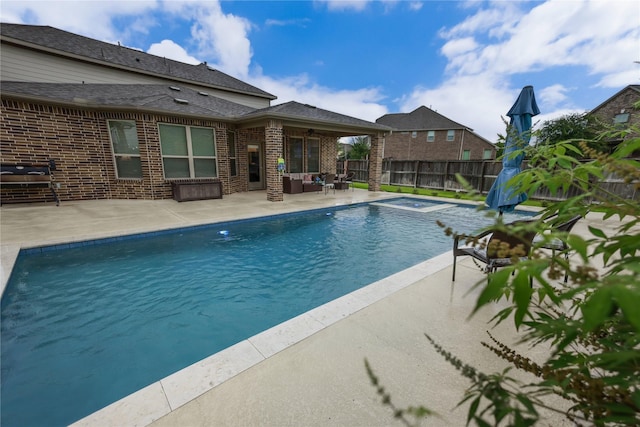 20503 Montecrest Cir, Spring, TX 77379 - view of swimming pool with a fenced backyard, a patio, an outdoor hangout area, and a ceiling fan
