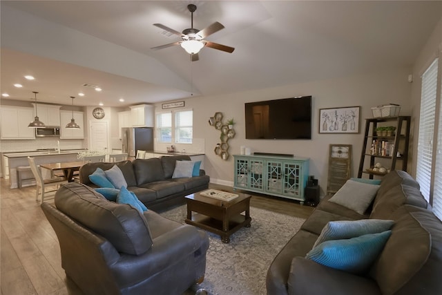 20503 Montecrest Cir, Spring, TX 77379 - living area featuring light wood-style flooring, a ceiling fan, lofted ceiling, and recessed lighting