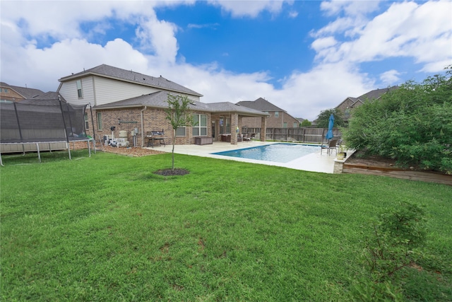 20503 Montecrest Cir, Spring, TX 77379 - view of pool featuring a trampoline, a patio area, and a fenced backyard