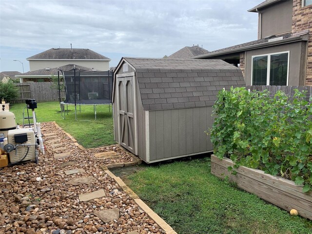 20503 Montecrest Cir, Spring, TX 77379 - view of yard featuring a shed, a trampoline, and a vegetable garden