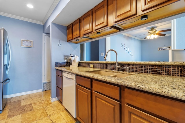 325 Carolcrest Ln Unit 2, Livingston, TX 77351 - kitchen with white dishwasher, stainless steel refrigerator with ice dispenser, a ceiling fan, ornamental molding, and light stone countertops