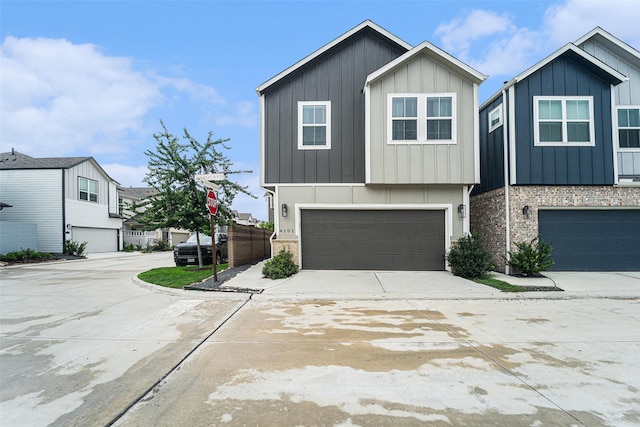 4101 Split Ivy Dr, Houston, TX 77080 - view of front of house featuring a garage, board and batten siding, and concrete driveway
