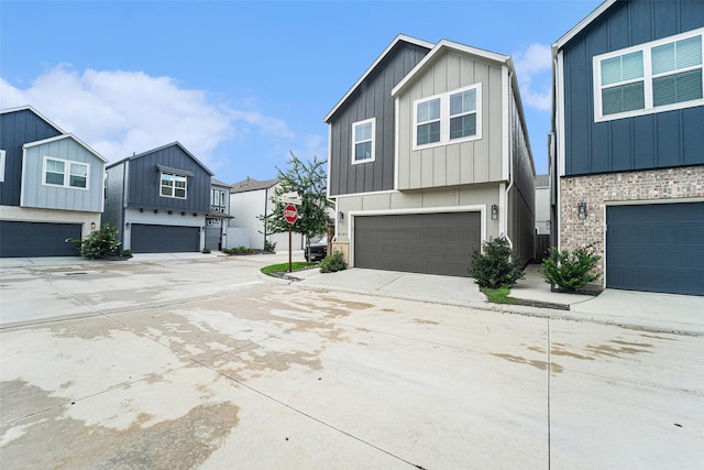 4101 Split Ivy Dr, Houston, TX 77080 - view of front of home with board and batten siding, an attached garage, and driveway