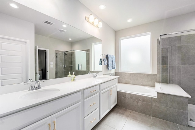 4101 Split Ivy Dr, Houston, TX 77080 - full bathroom with double vanity, tile patterned flooring, a shower stall, a garden tub, and recessed lighting