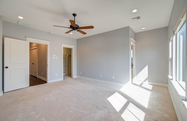 517 Fowler St, Houston, TX 77007 - unfurnished bedroom with carpet floors, a spacious closet, ceiling fan, and recessed lighting