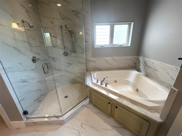 517 Fowler St, Houston, TX 77007 - full bathroom featuring a marble finish shower, marble finish floors, and a whirlpool tub