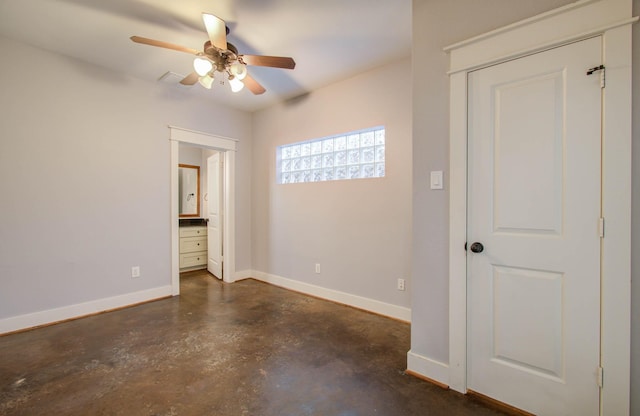 517 Fowler St, Houston, TX 77007 - empty room with finished concrete floors and a ceiling fan