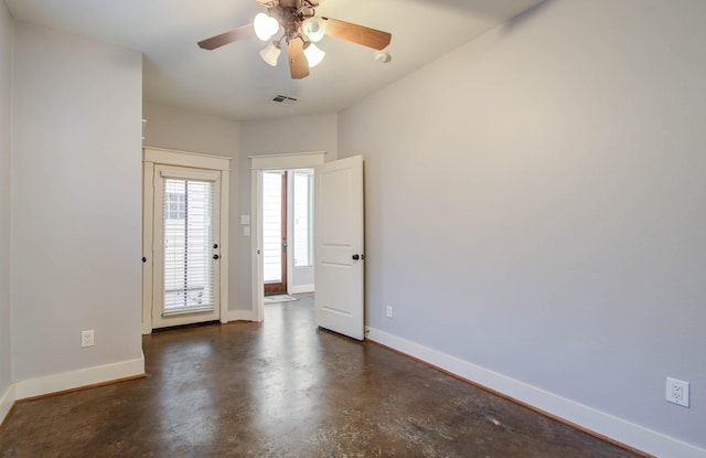 517 Fowler St, Houston, TX 77007 - empty room with finished concrete floors and a ceiling fan