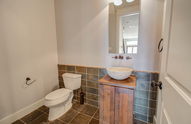 517 Fowler St, Houston, TX 77007 - half bathroom with vanity, tile patterned floors, and tile walls