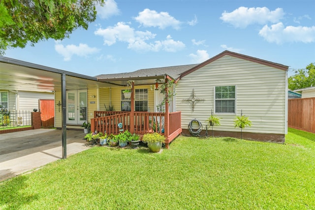 10329 Fairfax St, Houston, TX 77029 - rear view of house with french doors and concrete driveway