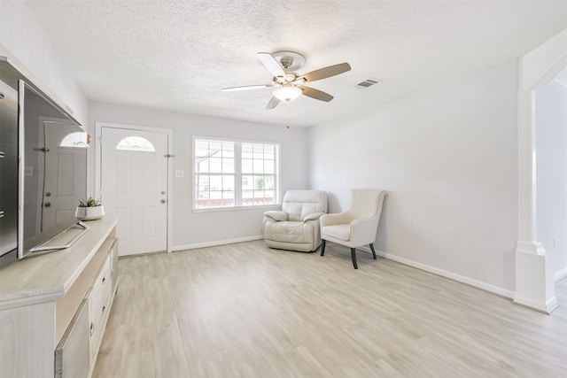 10329 Fairfax St, Houston, TX 77029 - unfurnished room featuring a ceiling fan, light wood finished floors, and a textured ceiling