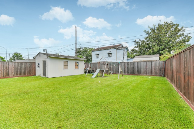 10329 Fairfax St, Houston, TX 77029 - fenced backyard with a playground and an outdoor structure