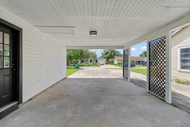 1000 W Thomas Ave, Pasadena, TX 77506 - view of patio / terrace featuring a carport and a residential view