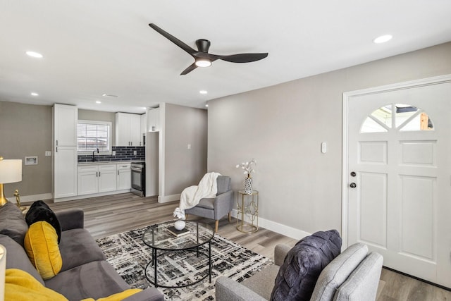 1000 W Thomas Ave, Pasadena, TX 77506 - living area with light wood-style floors, ceiling fan, and recessed lighting