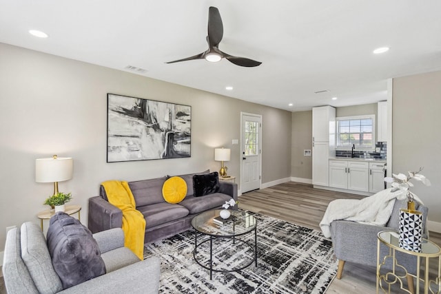 1000 W Thomas Ave, Pasadena, TX 77506 - living area featuring recessed lighting, light wood finished floors, healthy amount of natural light, and a ceiling fan