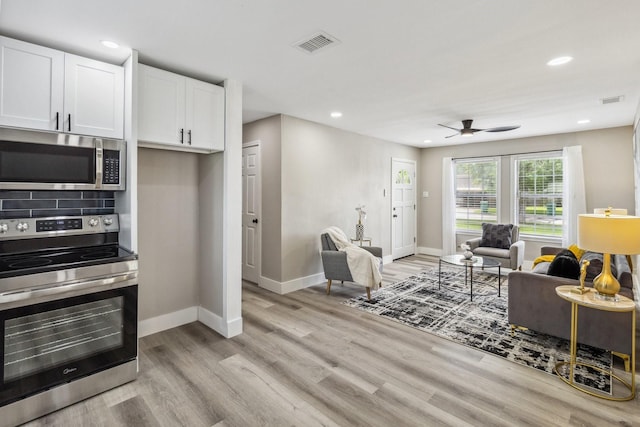 1000 W Thomas Ave, Pasadena, TX 77506 - living area featuring ceiling fan, light wood-style floors, and recessed lighting