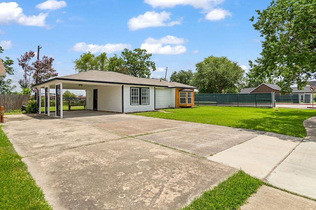 1000 W Thomas Ave, Pasadena, TX 77506 - rear view of house featuring a carport and concrete driveway