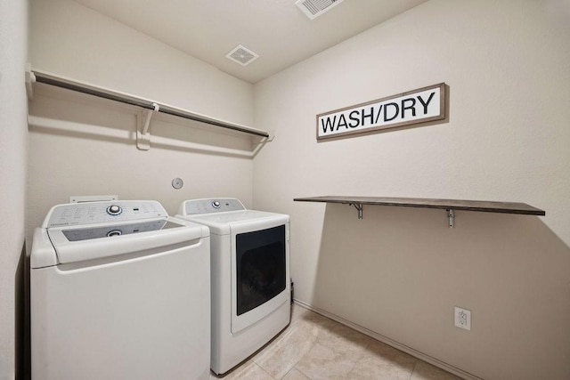 9618 Paloma Creek Dr, Tomball, TX 77375 - washroom featuring washing machine and dryer and light tile patterned floors