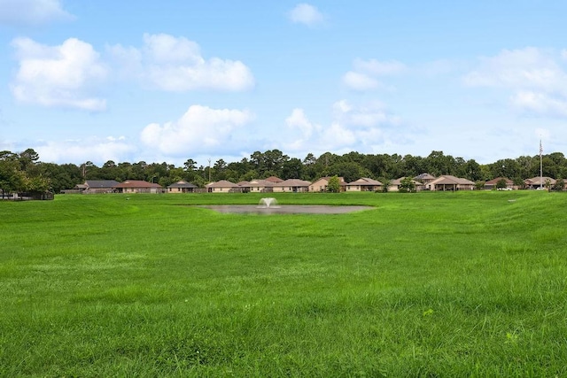 9618 Paloma Creek Dr, Tomball, TX 77375 - surrounding community with a lawn and a residential view