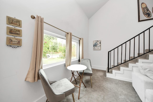 10747 Dulcimer St, Houston, TX 77051 - sitting room with high vaulted ceiling, carpet flooring, and stairway