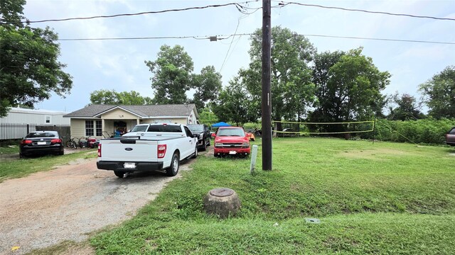 1915 Rothwell St, Stafford, TX 77477 - view of front of house with driveway and volleyball court
