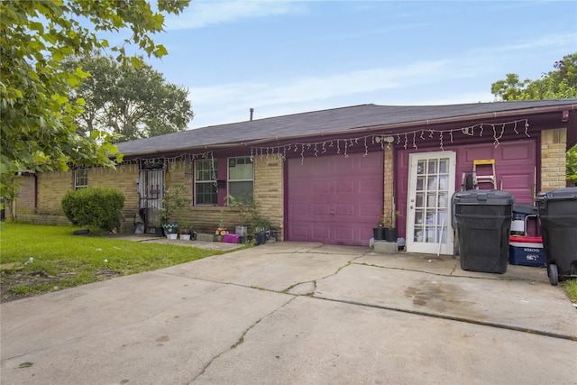 4115 Trail Lake Dr, Houston, TX 77045 - ranch-style home with concrete driveway, an attached garage, and brick siding
