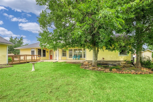 7027 Kurt Dr, Brenham, TX 77833 - rear view of property with a lawn