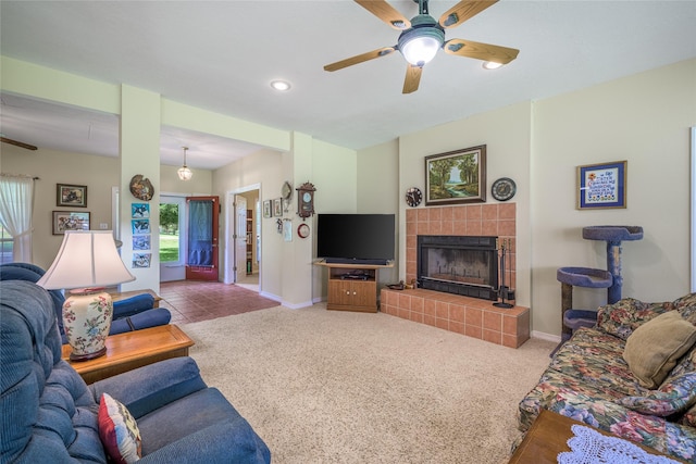 7027 Kurt Dr, Brenham, TX 77833 - living area with a ceiling fan, a tiled fireplace, carpet floors, and recessed lighting
