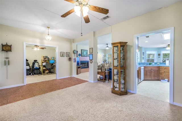 7027 Kurt Dr, Brenham, TX 77833 - interior space featuring light colored carpet, light tile patterned flooring, and a desk
