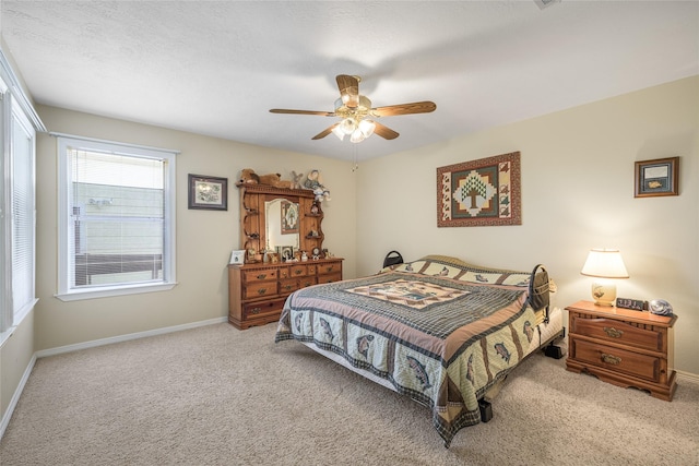 7027 Kurt Dr, Brenham, TX 77833 - carpeted bedroom featuring baseboards and ceiling fan