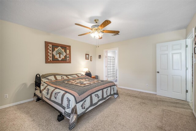 7027 Kurt Dr, Brenham, TX 77833 - carpeted bedroom with baseboards and a ceiling fan
