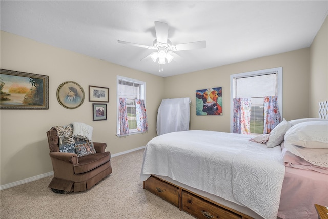 7027 Kurt Dr, Brenham, TX 77833 - carpeted bedroom with multiple windows and a ceiling fan