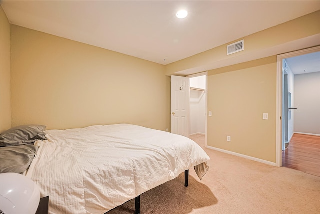 1860 White Oak Dr Unit 334, Houston, TX 77009 - bedroom featuring light colored carpet and recessed lighting