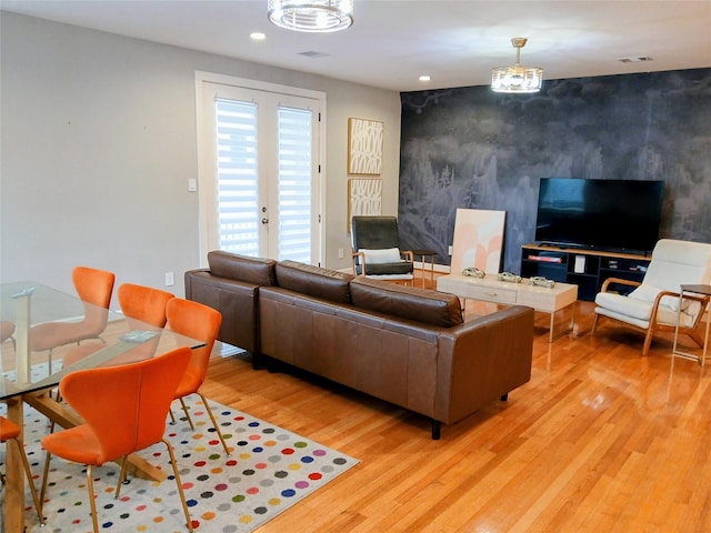 3333 Kilgore St, Houston, TX 77021 - living room with an accent wall, light wood-style floors, and recessed lighting
