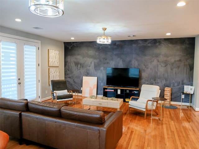 3333 Kilgore St, Houston, TX 77021 - living room featuring an accent wall, recessed lighting, and wood finished floors