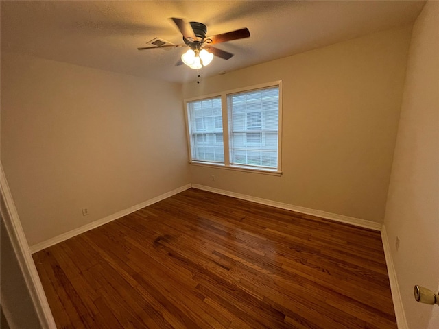 12834 Tosca Ln, Houston, TX 77024 - unfurnished room with ceiling fan and dark wood-style floors