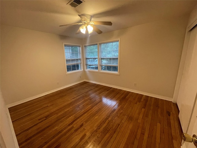 12834 Tosca Ln, Houston, TX 77024 - spare room featuring a ceiling fan and dark wood-style floors
