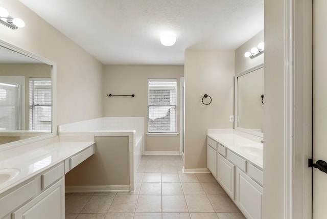 3202 Stoneydale Ln, Spring, TX 77388 - full bathroom with two vanities, tile patterned flooring, a garden tub, and a shower with door