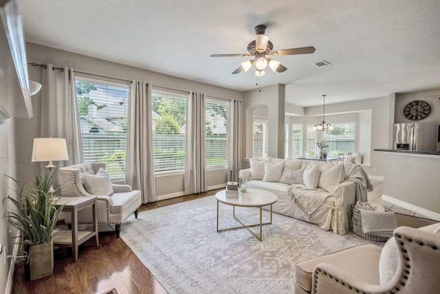 16407 Bogan Flats Ct, Houston, TX 77095 - living area with a ceiling fan, plenty of natural light, wood finished floors, and a textured ceiling