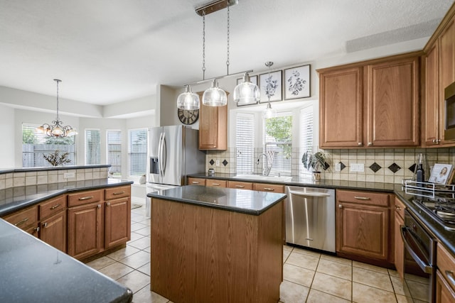 16407 Bogan Flats Ct, Houston, TX 77095 - kitchen with appliances with stainless steel finishes, dark countertops, light tile patterned flooring, and decorative backsplash