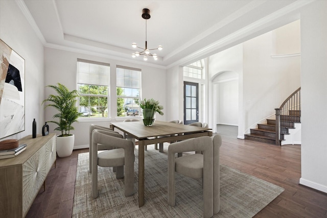 27403 Laurel Bay Ct, Katy, TX 77494 - dining area with healthy amount of natural light, a chandelier, stairs, and wood finished floors