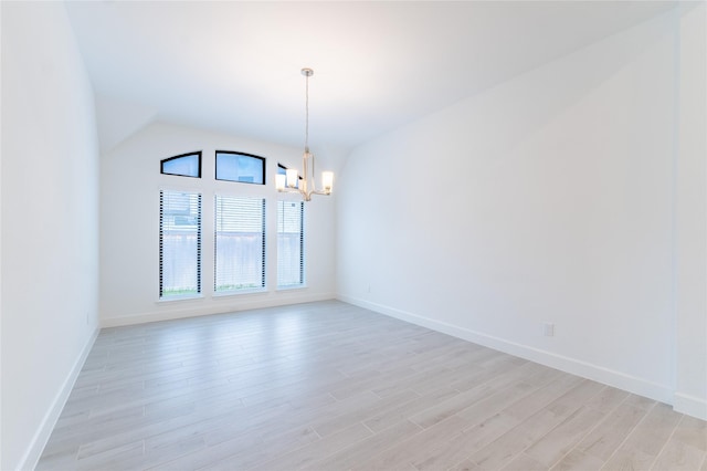 14811 Opossum Branch Ct, Cypress, TX 77433 - empty room featuring a chandelier, light wood-style floors, and lofted ceiling